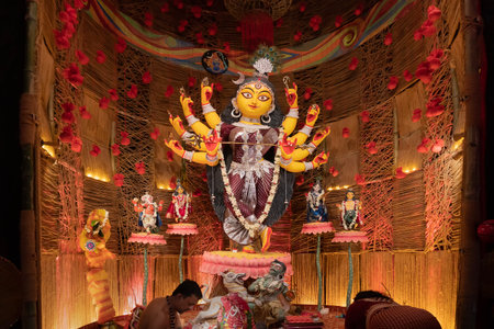 Howrah, West Bengal, India- 3rd October, 2022 : Beautifully decorated Durga idol is being worshipped inside puja pandal. Durga Puja is biggest festival of Hinduism, celebrated all over the world.のeditorial素材