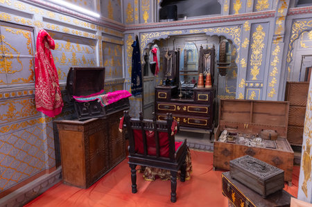Jaisalmer, Rajasthan, India - 16th October 2019 : Old mirror and dressing table with box for jewellery for wealthy Indian woman of Ancient India. Preserved inside in-house museum of Patwon ki haveli.のeditorial素材
