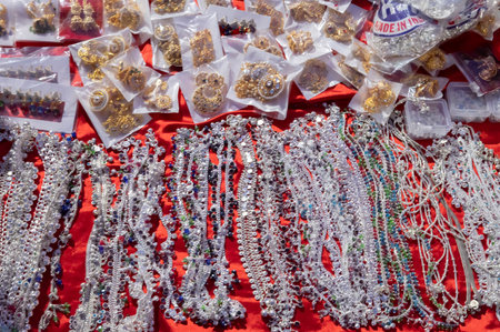 Jodhpur, Rajasthan, India - 19.10.2019 : White necklaces and gold plated earrings are being sold at famous Sardar Market and Ghanta ghar Clock tower in Jodhpur.のeditorial素材