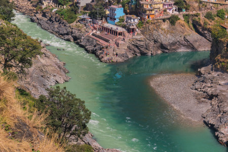 Bhagirathi river from left side and Alakananda river with turquoise blue colour from right side converge at Devprayag,Holy conflunece and form river Holy Ganges thereafter.Garhwal, Uttarakhand, India.の写真素材