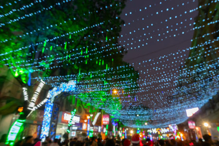 Kolkata, West Bengal, India - 26.12.2018 : Christmas celebration by enthusiastic young public at illuminated and decorated park street with lights and year end festive mood. Evening sky background.のeditorial素材