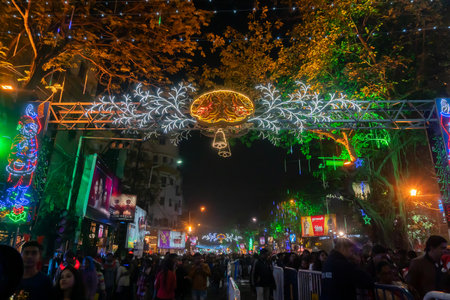 Kolkata, West Bengal, India - 25.12.2018 : Decorated lights and Christmas celebration at illuminated Park street with joy and year end festive mood. Night sky background.のeditorial素材