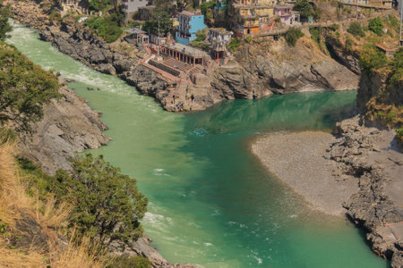Bhagirathi river from left side and Alakananda river with turquoise blue colour from right side converge at Devprayag,Holy conflunece and form river Holy Ganges thereafter.Garhwal, Uttarakhand, India.の写真素材