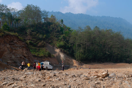Versay,Sikkim,India-22.03.2004:High altitude playground and stadium is being made by cutting tree and levelling soil, Environmental damage to Himalayan mountains causing natural disaster in mountains.のeditorial素材