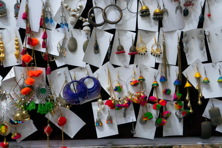 Various colorful shapes and shades of earrings , handicrafts on display at Jaisalmer city, Rajsathan, India.の写真素材