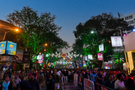 Kolkata, West Bengal, India - 26.12.2018 : Christmas celebration by enthusiastic young public at illuminated and decorated park street with lights and year end festive mood. Blue sky background.のeditorial素材