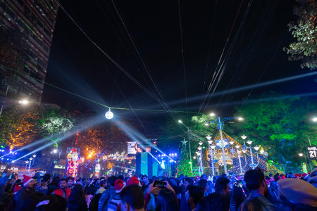 Kolkata, West Bengal, India - 25.12.2018 : Decorated lights and Christmas celebration at illuminated Park street and Camac Street junction . Citizens enjoying with joy and year end festive mood.のeditorial素材