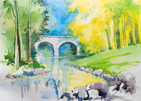 Beautiful scenery of a white bridge in a park with blue sky and reflection on water. Yellow and green trees in the background. Hand painted watercolor art created with watercolor paint and brushes.の写真素材