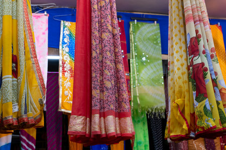 Rajasthani womens clothes are hanging for sale , being displayed in a shop at famous Sardar Market...