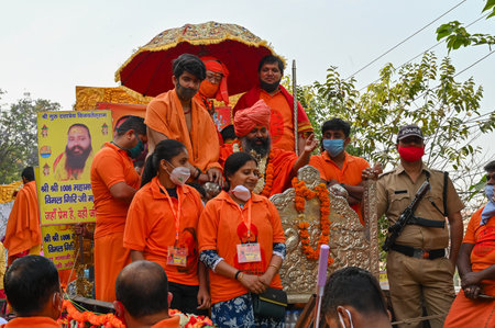 Haridwar, Uttarakhand, India - 13th April 2021 : Hindu sadhus, sanyasis in bright saffron dresses in...
