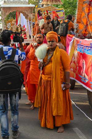 Haridwar, Uttarakhand, India - 13th April 2021 : Hindu sadhus, sanyasis in bright saffron dresses...
