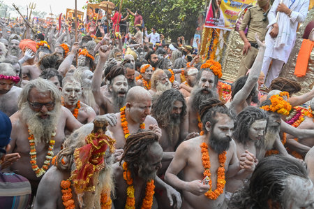 Haridwar, Uttarakhand, India - 13th April 2021 : Purno Kumbhmela event.Hindu naked sadhus, naga babas, naga sanyasis running for having shahi snaan on river Ganges and shouting Har Har Mahadev.のeditorial素材