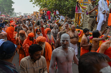 Haridwar, Uttarakhand, India - 13th April 2021 : Hindu sadhus, sanyasis in bright saffron dresses walking in procession for shahi snaan on Holy river Ganges. Kumbhmela event.のeditorial素材