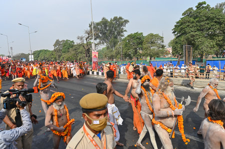 Haridwar, Uttarakhand, India - 13th April 2021 : Hindu naked sadhus, naga babas, naga sanyasis running for having shahi snaan on river Ganges and shouting Har Har Mahadev. Kumbhmela event.のeditorial素材