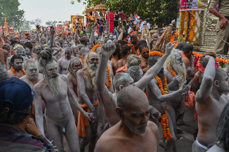 Haridwar, Uttarakhand, India - 13th April 2021 : Purno Kumbhmela event. Hindu naked sadhus, naga babas, naga sanyasis running for having shahi snaan on river Ganges and shouting Har Har Mahadev.のeditorial素材