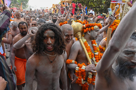 Haridwar, Uttarakhand, India - 13th April 2021 : Hindu naked sadhus, naga babas, naga sanyasis running for having shahi snaan on river Ganges and shouting Har Har Mahadev. Kumbhmela event.のeditorial素材