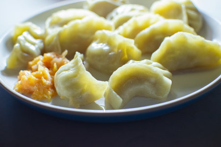 Side view of Momo, type of South Asian dumpling; native to Tibet, Nepal, Bhutan and Sikkim. It is...