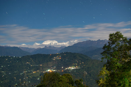 Beautiful view of moonlit Kanchenjungha Mountain Range of great Himalayas, shot in a full moon night. Rinchenpong, Sikkim, Indiaの写真素材