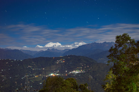 Beautiful view of moonlit Kanchenjungha Mountain Range of great Himalayas, shot in a full moon night. Rinchenpong, Sikkim, Indiaの写真素材