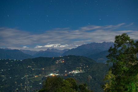 Beautiful view of moonlit Kanchenjungha Mountain Range of great Himalayas, shot in a full moon night. Rinchenpong, Sikkim, Indiaの写真素材