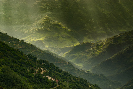 Sun rays falling on Himalayan mountain range, scenic beauty of layers of mountains, Okhrey, sikkim, India. Okhrey village a remote place in Sikkim where mountain range view is enjoyed by tourists.の写真素材
