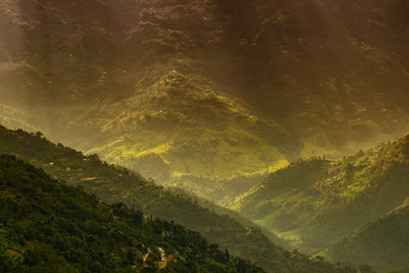 Sun rays falling on Himalayan mountain range, scenic beauty of layers of mountains, Okhrey, sikkim,...