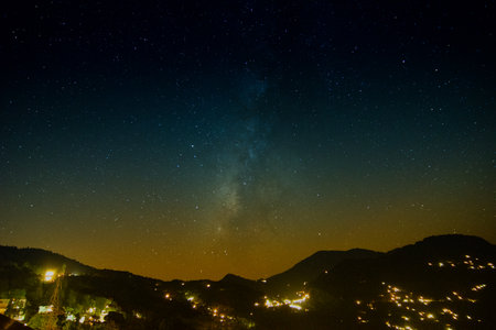 Galaxy or Milkyway as seen in the evening sky at Rinchenpong,Sikkim,India. Himalayan mountain range in the foreground. Cloudless night sky full of stars at Sikkim is favourite attraction for tourists.の写真素材
