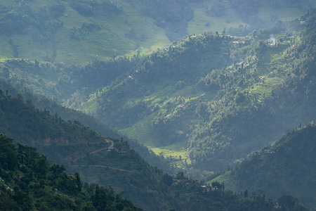 Beautiful Sun rays falling on mountain range, play of light, scenic beauty of Okhrey, sikkim, India....