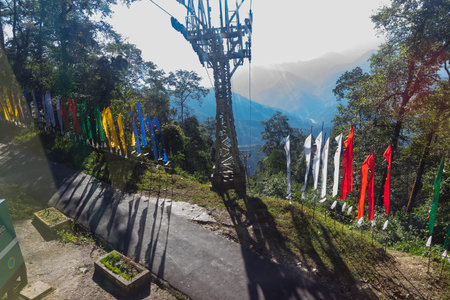 View from top at namchi ropeway, Buddhist religious flags at Namchi,Sikkim,India. It is a very popular tourist attraction for tourists who can get a view of great Himalayan Mountains at Sikkim, India.の写真素材
