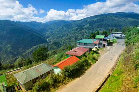 Beautiful way to Okhrey village, Himalayan mountain range in the background . Okhrey is a remote village with scenic natural vista in background, in Sikkim, India.の写真素材