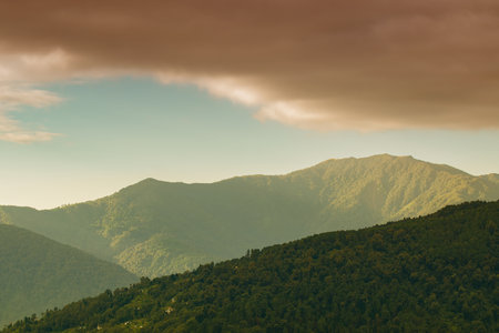 Sun rays falling on Himalayan mountain range, scenic beauty of layers of mountains, Okhrey, sikkim,...