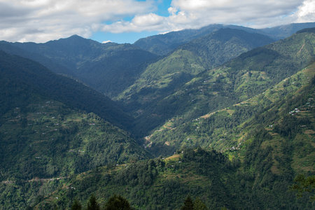 Sun rays falling on Himalayan mountain range, scenic beauty of layers of mountains, Okhrey, sikkim,...