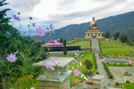 Beautiful huge statue of Lord Buddha, at Rabangla , Sikkim , India. Surrounded by Himalayan Mountains, it is called Buddha Park - a popular tourist attraction for tourists from all over India.の写真素材