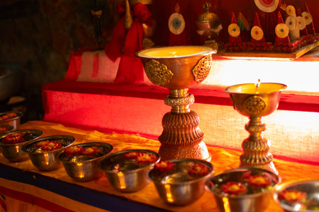 Diyas or lamps, sacred Buddhist religious objects put together, inside peaceful Buddhist Monastery. Okhrey Village, Sikkim, India. Image shot with permission.の写真素材