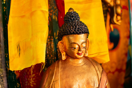 Goutama Buddha, Buddhist religious leader, being worshipped inside Okhrey Monastery - Sikkim , India. Image shot with permission.の写真素材