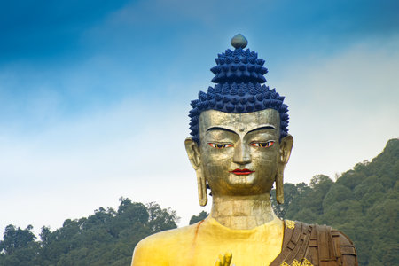 Beautiful huge statue of Lord Buddha, at Rabangla , Sikkim , India. Surrounded by Himalayan Mountains, it is called Buddha Park - a popular tourist attraction for tourists from all over India.の写真素材