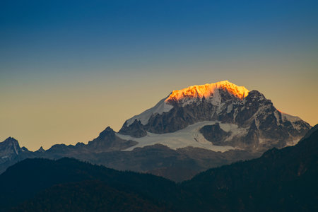 Beautiful first light from sunrise on Mount Pandim, at an elevation of 6,691 m , 21,952 ft above sea level. Himalayan mountain range, Sikkim, India. Sikkim is popular for tourists from all over India.の写真素材