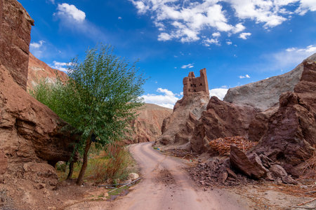 Road leading to Basgo or Bazgoo, a village situated on the bank of the Indus river in Leh district, Ladakh, India. Basgo Monastery and historical ruins with Himalayan mountains. Blue sky background.の写真素材