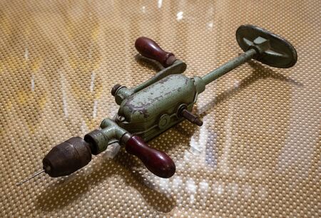 antique hand drill with two gearの写真素材