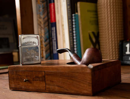 smoker wooden pipe with wooden box and benzine lighterのeditorial素材