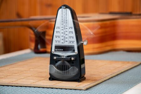 old style mechanical analog metronom is in actionの写真素材