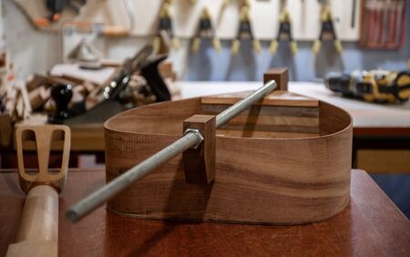 body of mediterranean flat lavta musical instrument on the workbenchの写真素材