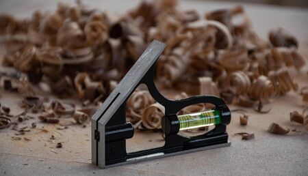 spirit level / metal chassis water gauge on the workbenchの写真素材
