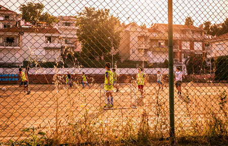 first outdoor training after coronavirus, young boys football team on the field.のeditorial素材
