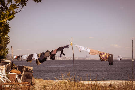 clothes that are washed and hung, left to dry on sea side, outdoor. island life.の写真素材