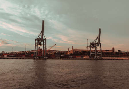 huge cranes and containers on the sea freight loading platformのeditorial素材
