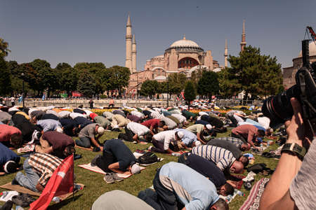 Istanbul/Turkey - July 24, 2020: Opening of the Hagia Sophia church / museum as a mosque and the first 'Friday' pray with the president of Turkey. People pray on the street in Ayasofya square, outdoorのeditorial素材