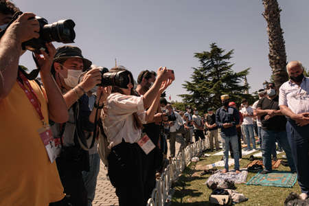 Istanbul/Turkey - July 24, 2020: Opening of the Hagia Sophia church / museum as a mosque and the first 'Friday' pray. Photojournalists take pictures of people who pray outside of mosqueのeditorial素材