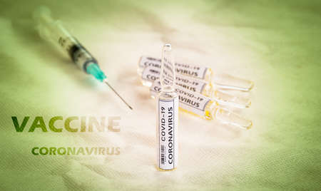 concept of stop corona virus, Covid-19 vaccines with injector.の写真素材