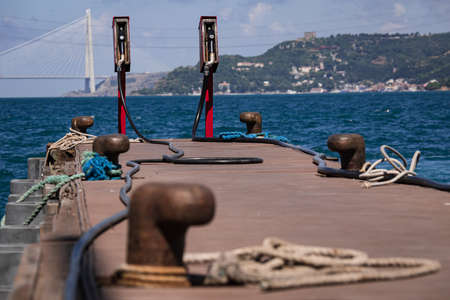 gas station for boats with two petrol pumps and bollards for the boats.の写真素材